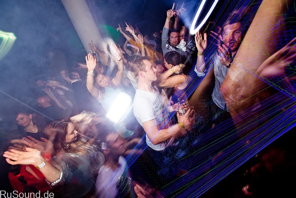Dancers in motion under club lights