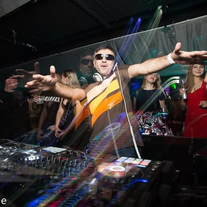 Jeff Kuzz reaching toward the crowd during a club performance